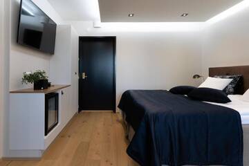 Фото номера Улучшенный номер с кроватью размера «king-size» Отель Hotel Fjalar г. Сало 4